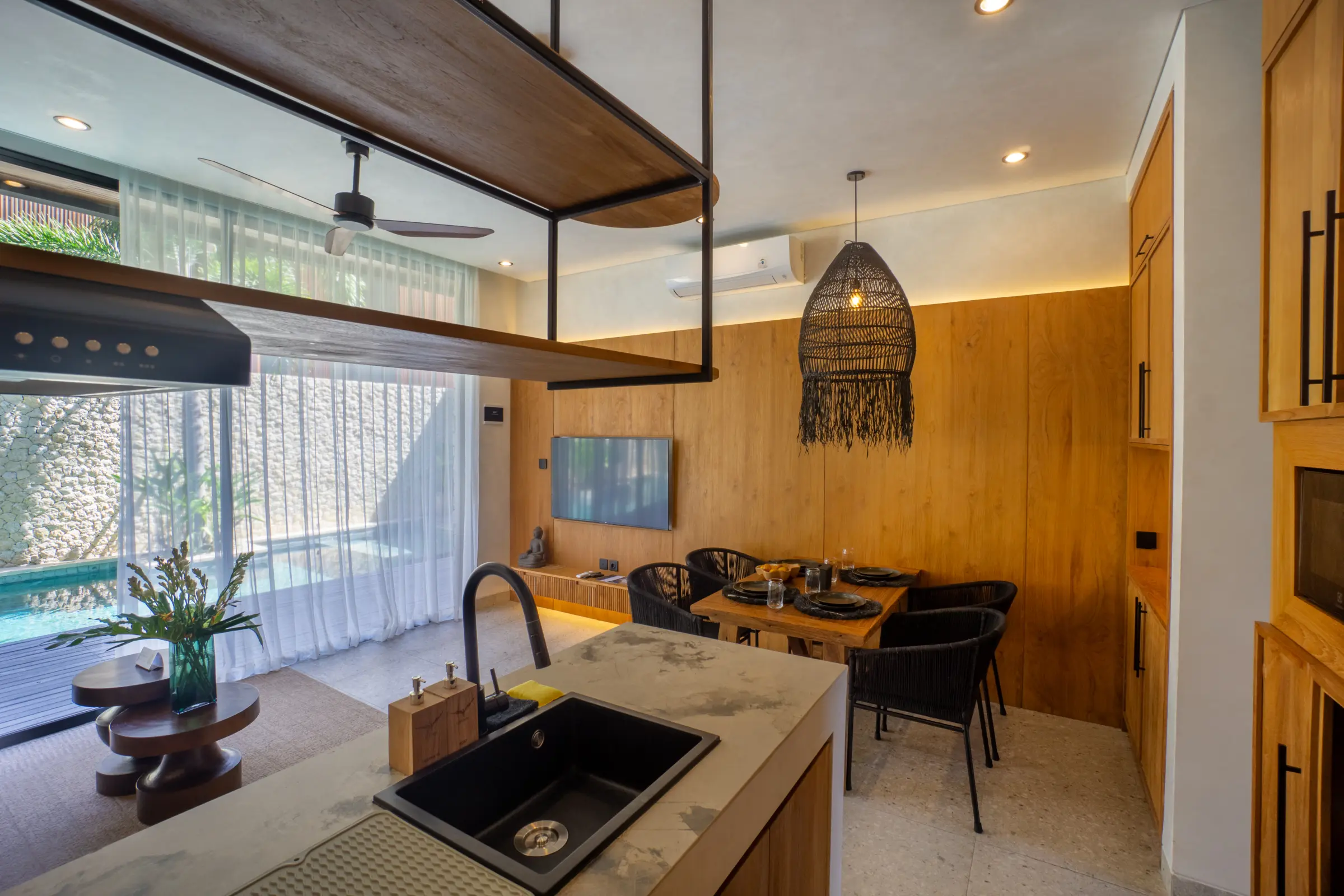 Kitchen and dining area opening onto the terrace, Rahya Villas, Uluwatu