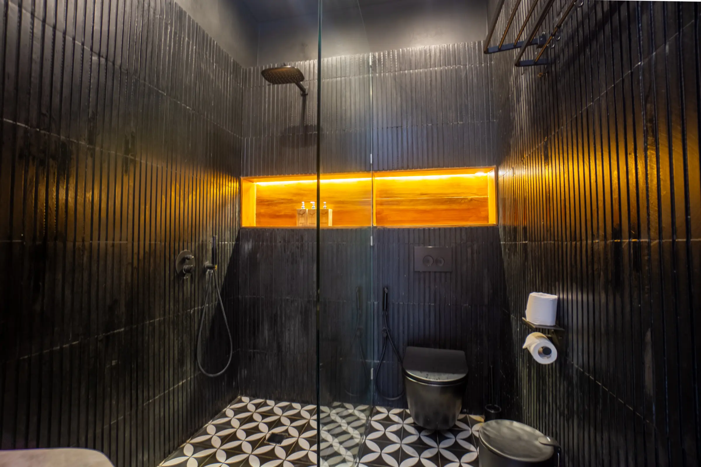 Walk-in shower with patterned floor tiling in a bathroom at Rahya Villas, Uluwatu